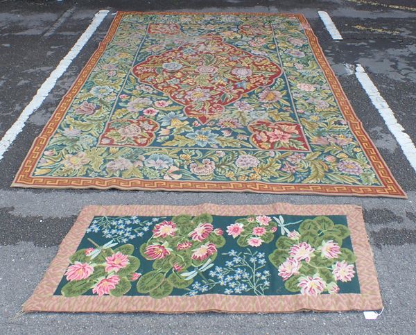 A FLORAL NEEDLEWORK CARPET