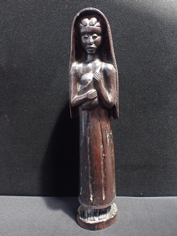 A CARVED AFRICAN HARDWOOD FIGURE