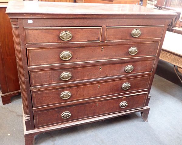 A GEORGE III OAK AND MAHOGANY CHEST OF DRAWERS