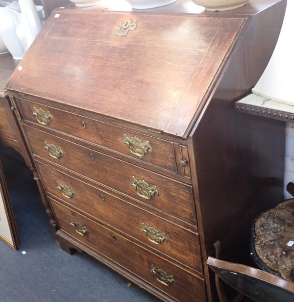 A GEORGE III PROVINCIAL OAK BUREAU