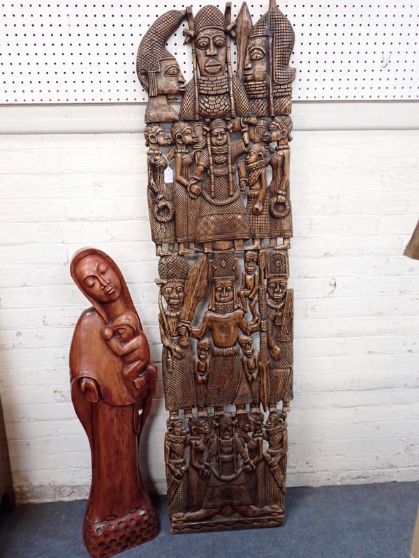 A LARGE AFRICAN CARVED PANEL