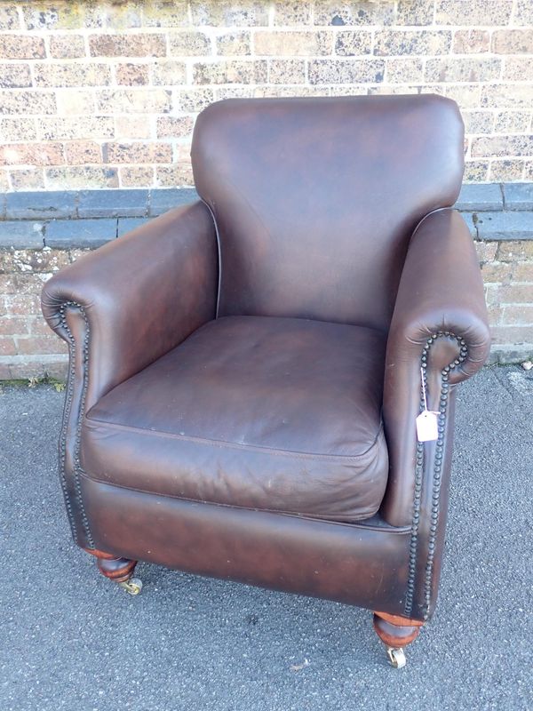 A THOMAS LLOYD STUDDED BROWN LEATHER CLUB STYLE ARMCHAIR