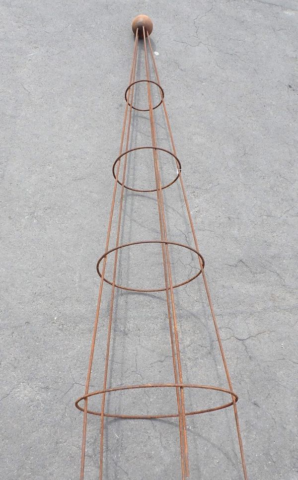 A METAL GARDEN OBELISK