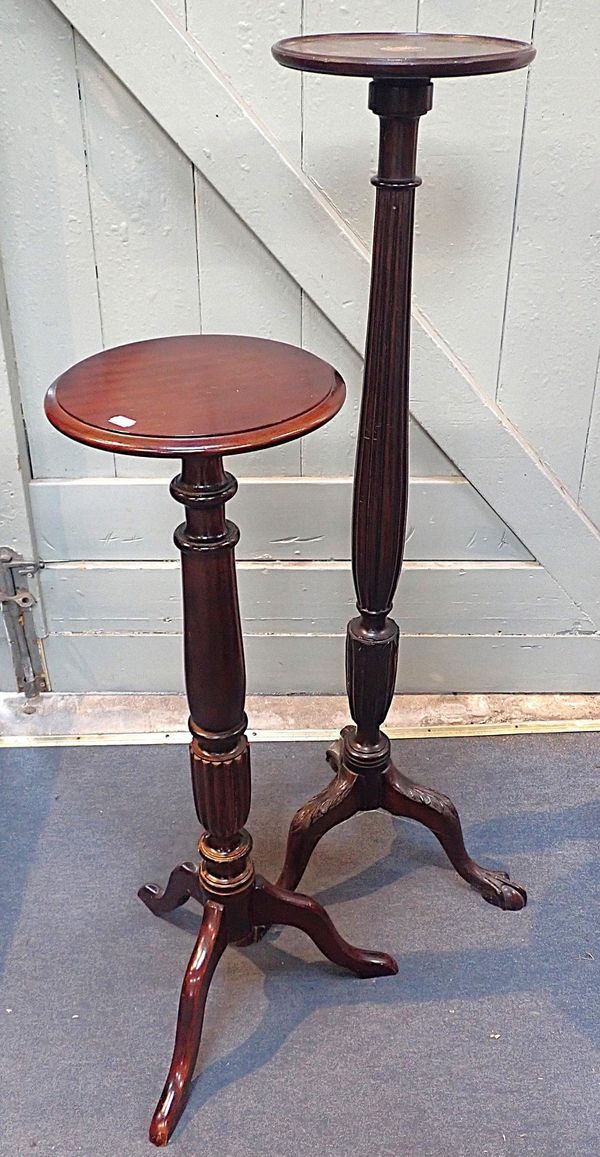 A MAHOGANY TORCHERE WITH LEAF CARVING