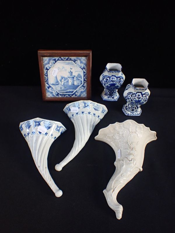 A PAIR OF DELFTWARE WALL POCKETS