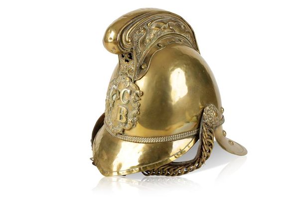 A BRASS FIRE HELMET from the C.C.F.B.