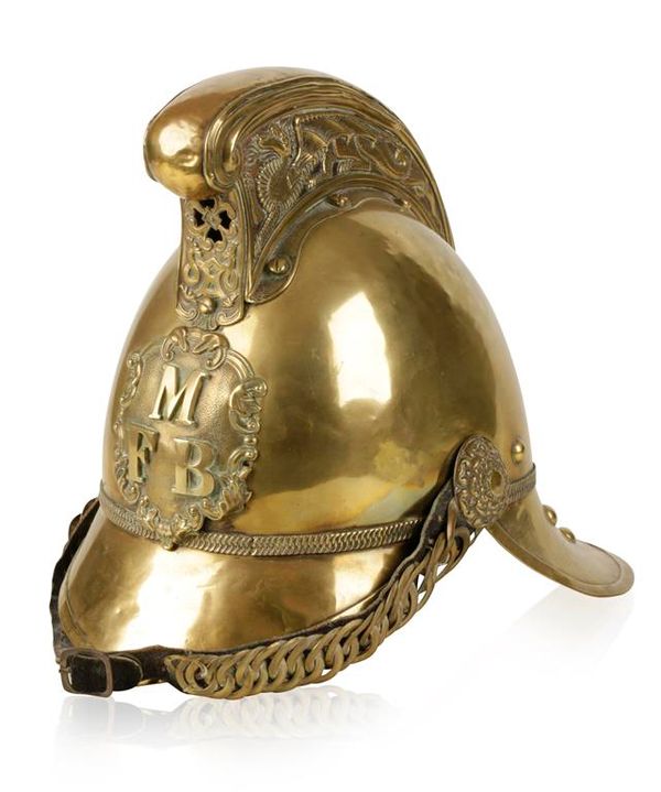 A BRASS FIRE HELMET from the M.F.B.