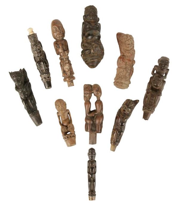 TEN MALAYSIAN CARVED WOOD AND HORN DAGGER HANDLES