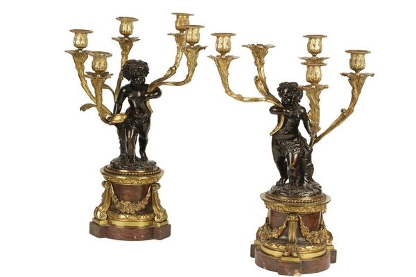 PAIR OF PATINATED BRONZE AND ORMOLU FIVE-BRANCH CANDELABRA