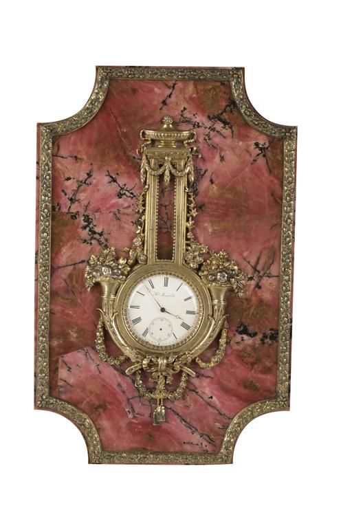 H MOSER & CIE: PINK HARDSTONE AND BRONZE MOUNTED TABLE CLOCK