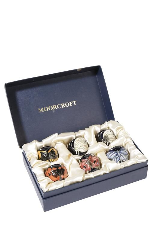 MOORCROFT: A SET OF SIX "BUTTERFLY" LIMITED EDITION EGG CUPS