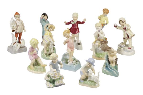 SET OF TWELVE ROYAL WORCESTER "MONTHS OF THE YEAR" BONE CHINA FIGURES