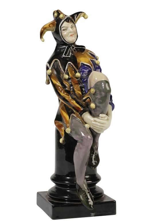 A ROYAL DOULTON CHINA FIGURE "A JESTER"