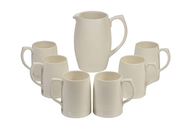 KEITH MURRAY FOR WEDGWOOD: A BEER JUG AND SIX MUGS