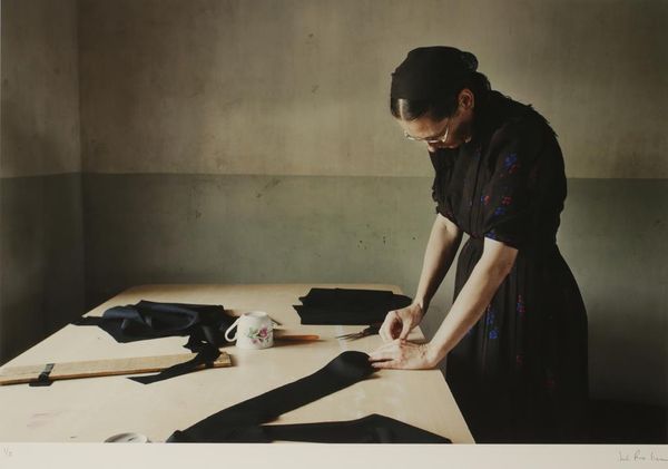 LARGE FORMAT PHOTGRAPHIC PRINT OF A SEAMSTRESS