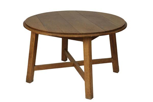 AMBROSE HEAL FOR HEAL & SON: AN OAK CIRCULAR DINING TABLE