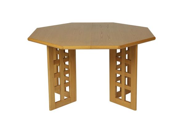 IN THE MANNER OF CHARLES RENNIE MACKINTOSH: A HEAL'S OAK HEXAGONAL EXTENDING DINING TABLE