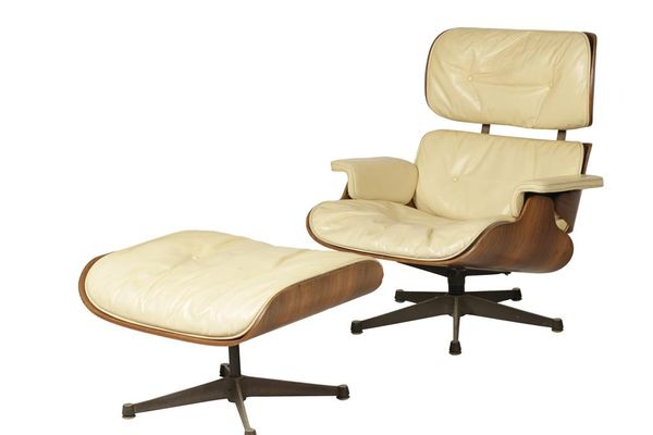 CHARLES & RAY EAMES FOR HERMAN MILLER: A ROSEWOOD AND LEATHER "670" LOUNGE CHAIR AND "671" FOOTSTOOL