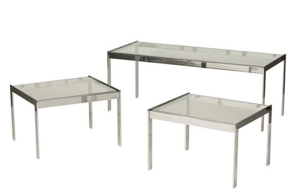 ATTRIBUTED TO MERROW ASSOCIATES: A NEST OF THREE CHROME AND GLASS TABLES