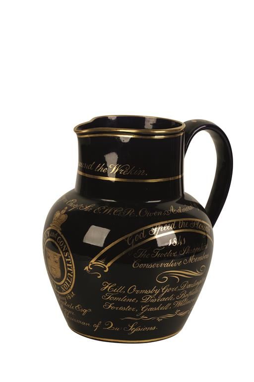 RARE BLUE GLAZED POTTERY JUG decorated in gilt with a dedication