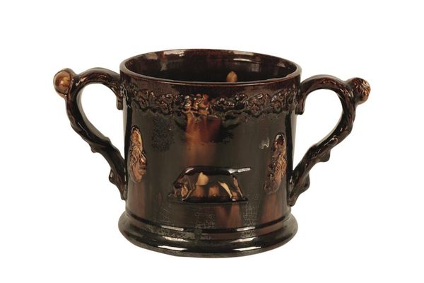 BROWN GLAZED POTTERY LOVING CUP moulded with portrait medallions