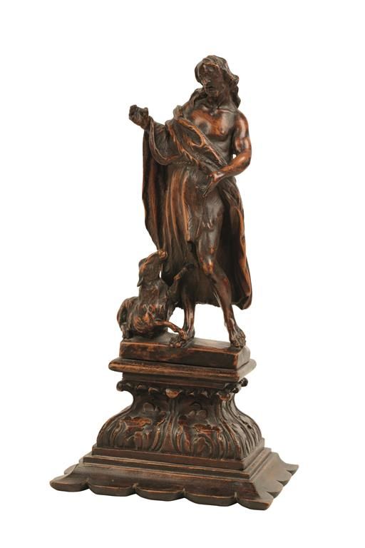 A CONTINENTAL CARVED FRUITWOOD FIGURE OF CHRIST AND THE LAMB