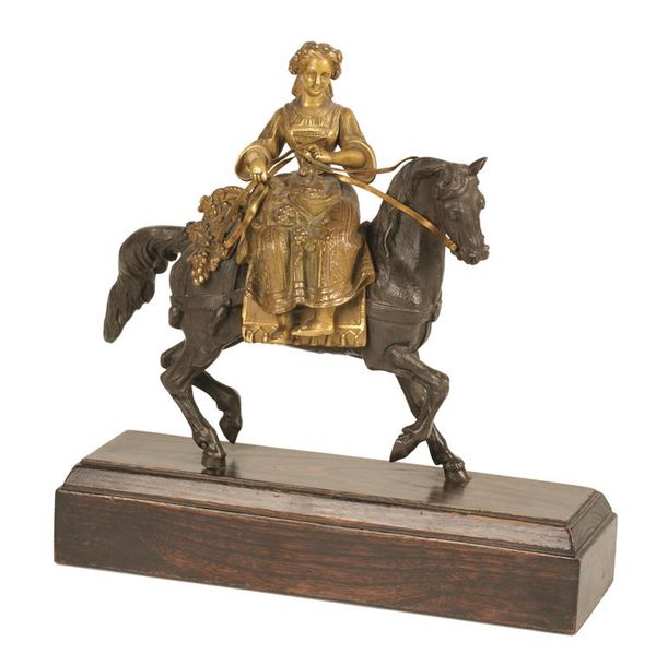 A 19TH CENTURY BRONZE AND PARCEL GILT FIGURE OF A MAIDEN ON HORSEBACK