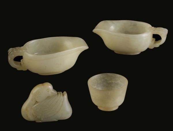 TWO MING STYLE CELADON JADE LIBATION CUPS, EARLY 20TH CENTURY