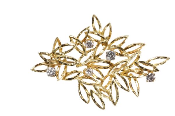 A DIAMOND AND GOLD FOLIATE BROOCH