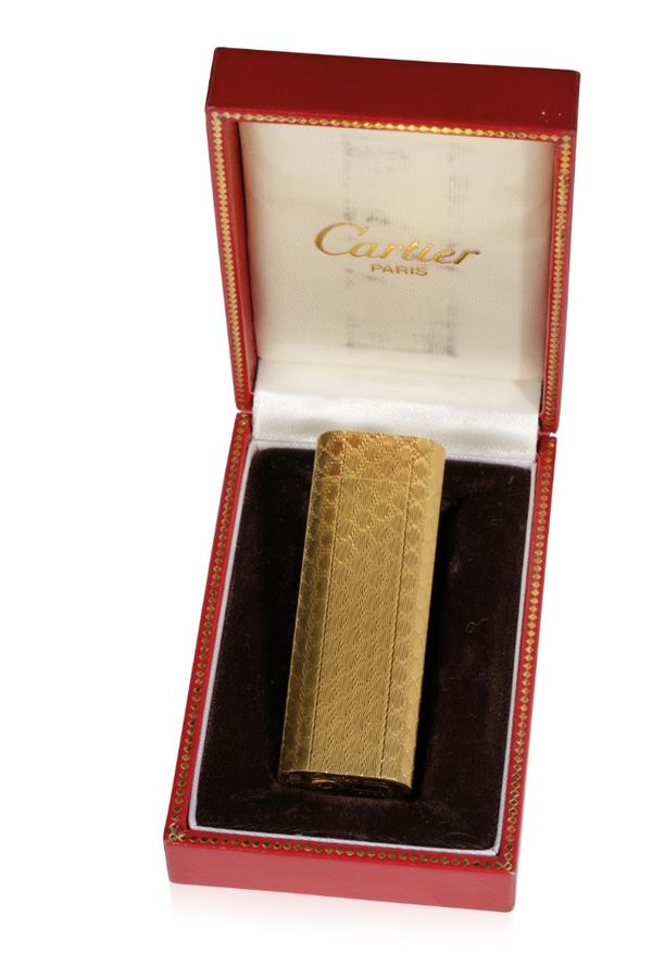 CARTIER: A GOLD PLATED CIGARETTE LIGHTER