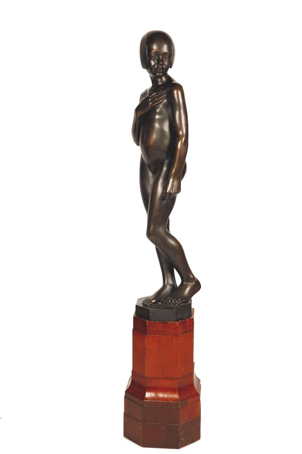 WILHELM KRIEGER (1877-1945) A cast bronze statue of a naked young girl