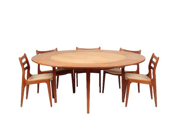 DYRLUND: A TEAK "FLIP-FLAP" DINING TABLE AND CHAIRS