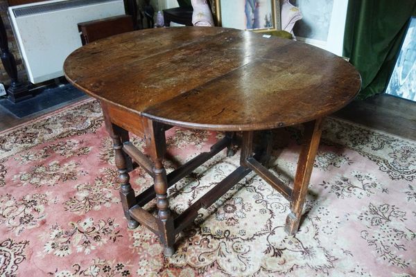 AN OAK GATELEG TABLE