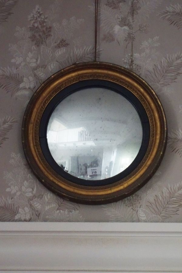 A LATE REGENCY CONVEX WALL MIRROR