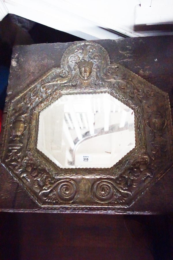 A DUTCH 17TH CENTURY STYLE BRASS REPOUSSE WALL MIRROR