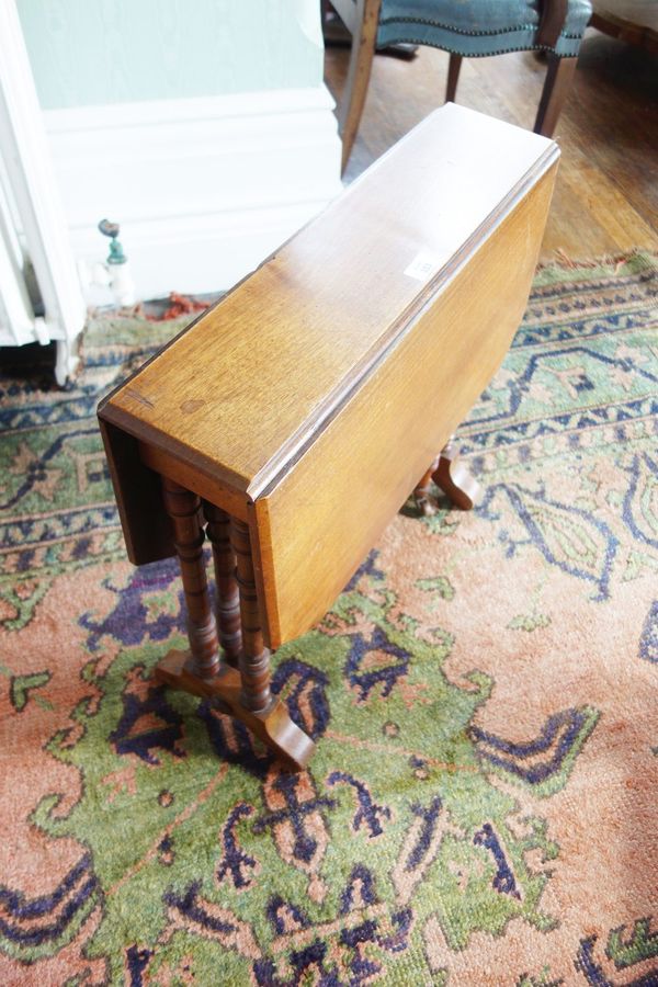 AN EDWARDIAN MAHOGANY SMALL SUTHERLAND TABLE