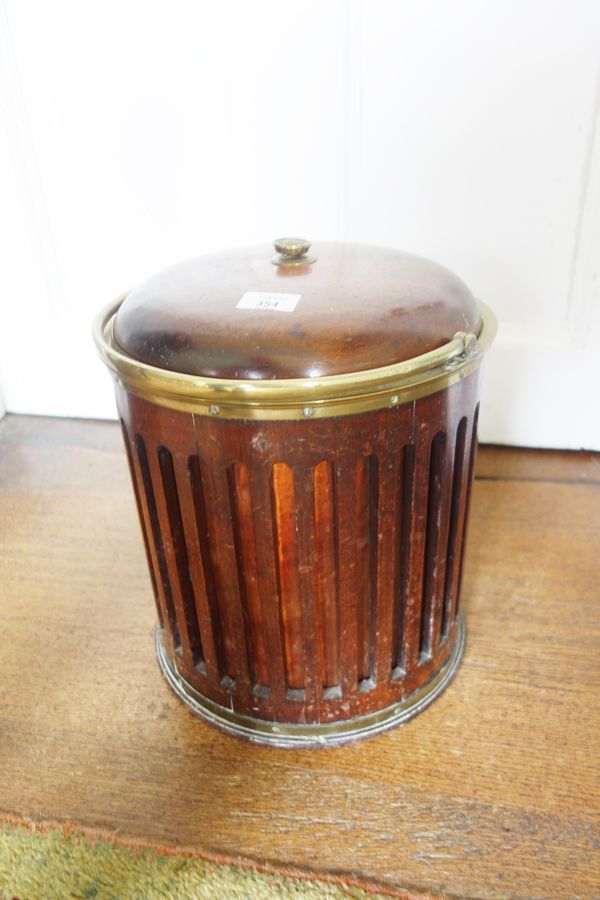 A REGENCY STYLE MAHOGANY AND BRASS BOUND BUCKET