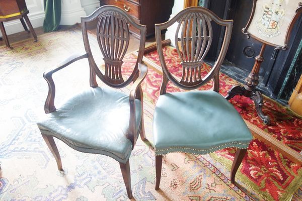 A SET OF TWELVE HEPPLEWHITE STYLE MAHOGANY DINING CHAIRS