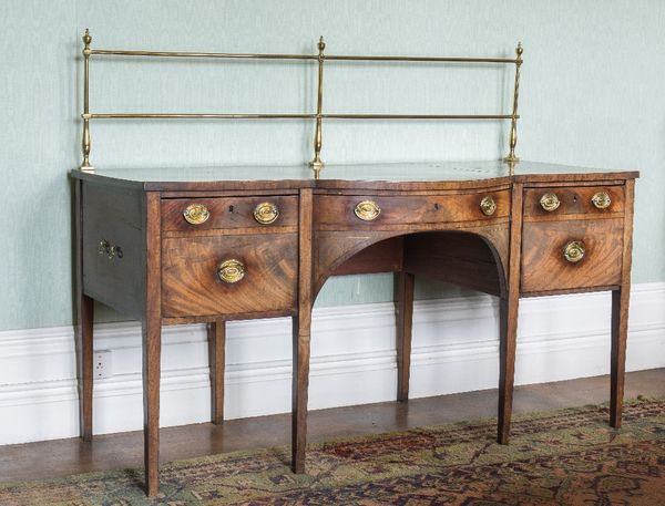 A GEORGE III SHERATON STYLE MAHOGANY SIDEBOARD