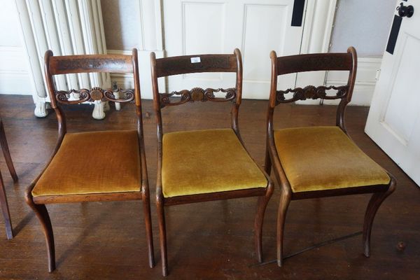 A SET OF SIX REGENCY SIMULATED ROSEWOOD AND BRASS INLAID DINING CHAIRS