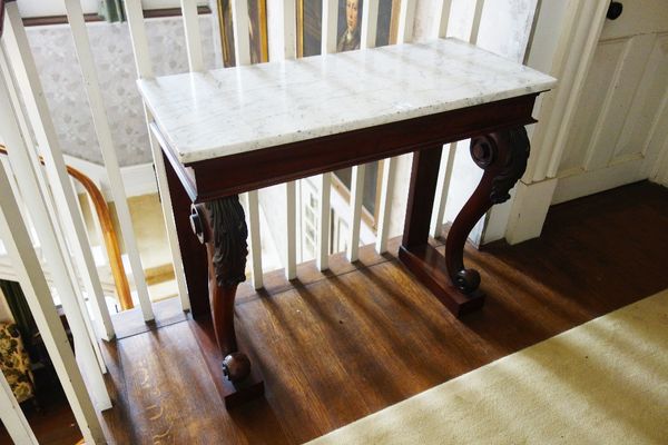 A LATE REGENCY MAHOGANY CONSOLE TABLE