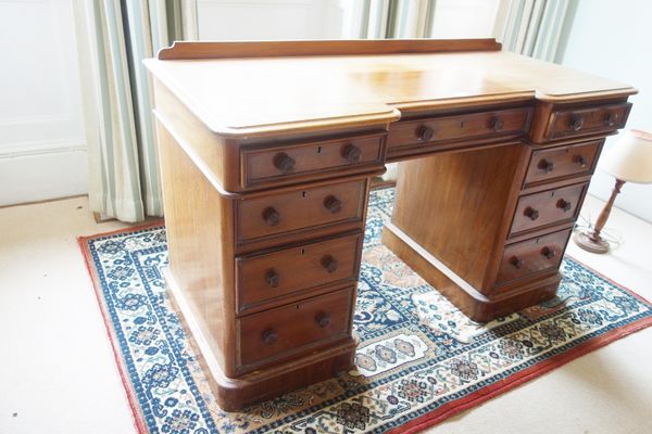 A VICTORIAN MAHOGANY TWIN PEDESTAL DESK