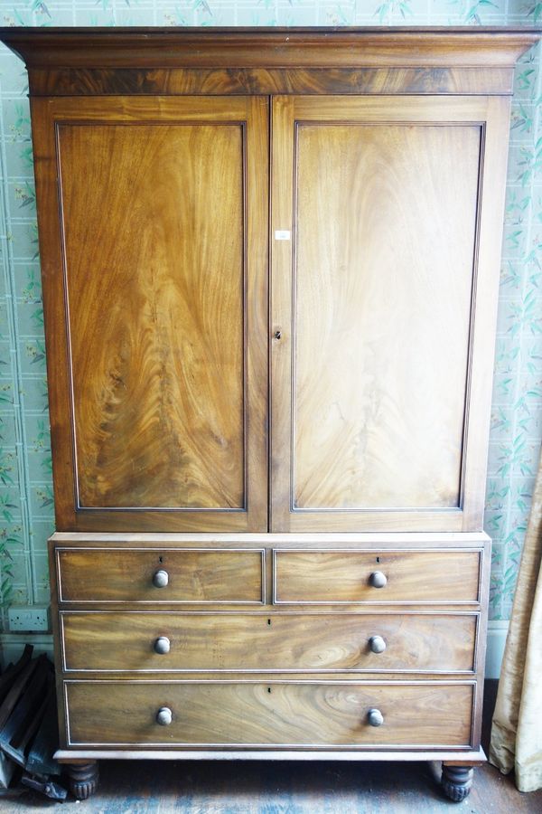 A LATE REGENCY MAHOGANY LINEN PRESS