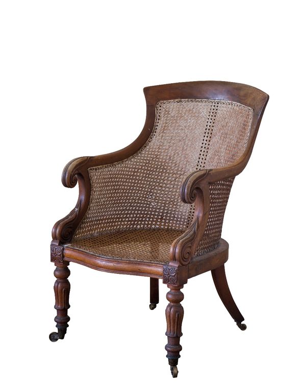 A LATE REGENCY MAHOGANY LIBRARY BERGERE ARMCHAIR