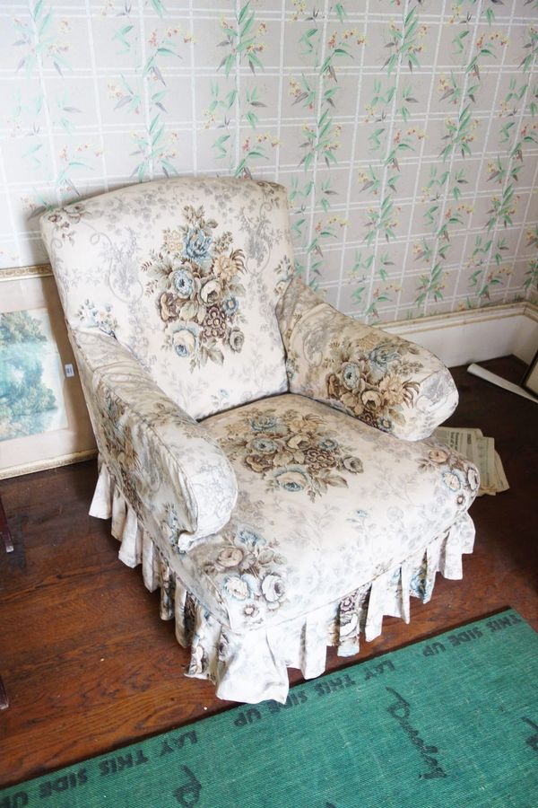 A VICTORIAN UPHOLSTERED ARMCHAIR