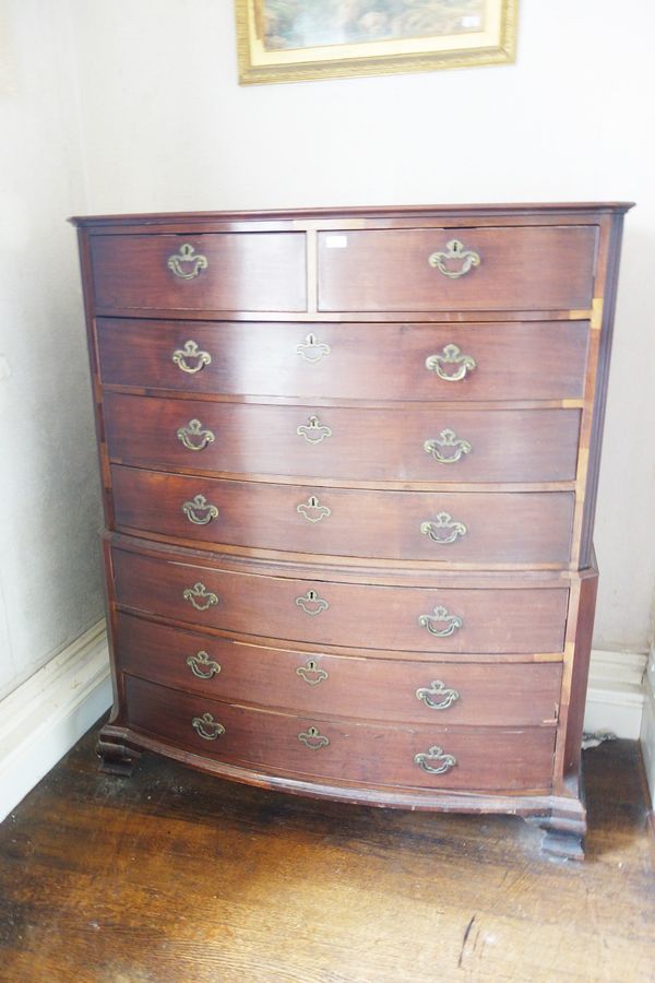 AN EARLY VICTORIAN MAHOGANY BOW FRONT CHEST ON CHEST