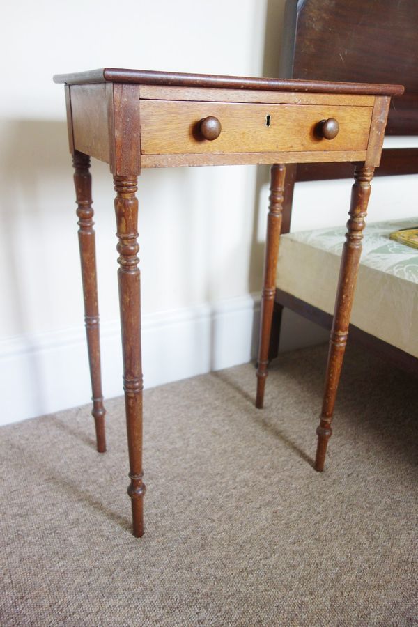 A SMALL LATE REGENCY BEDSIDE TABLE