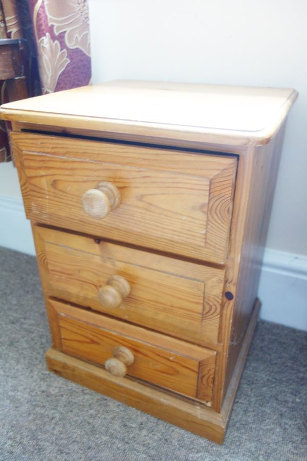 A CONTEMPORARY PINE BEDSIDE CUPBOARD