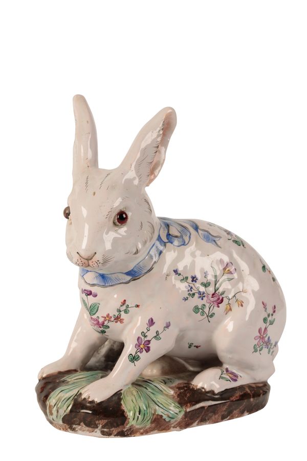 AN EMILLE GALLE FAIENCE FIGURE OF A RABBIT