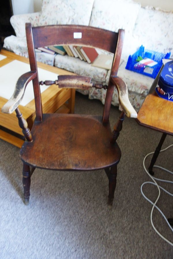 A LATE VICTORIAN MENDLESHAM TYPE FARMHOUSE ARMCHAIR